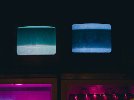 Old retro tv with noise effect in the dark.の写真素材