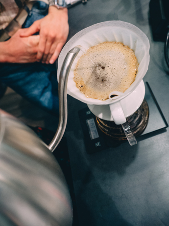 Making pour-over coffee with a hario V60 dripper.の写真素材