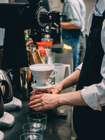 Making pour-over coffee with a hario V60 dripper.の写真素材