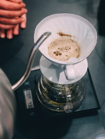 Making pour-over coffee with a hario V60 dripper.の写真素材