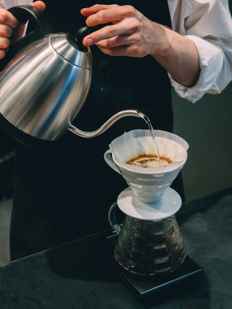Making pour-over coffee with a hario V60 dripper.の写真素材