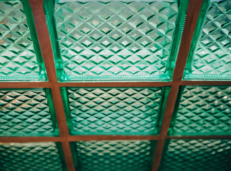 Green glass wall with light. background texture.の写真素材