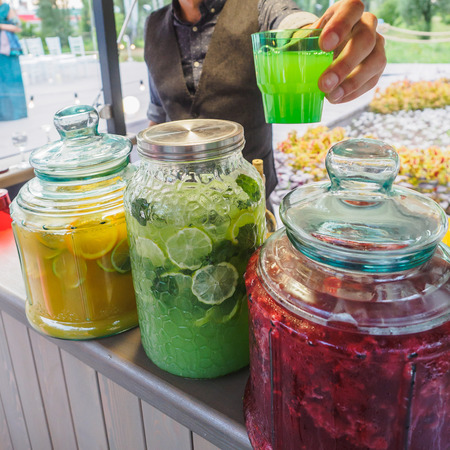 Fresh cocktail bar bottles with fruit berry juices.の写真素材