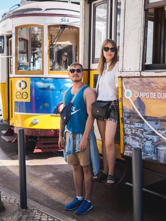 Lisbon, Portugal - SEPTEMBER 24 2017: Tourists with vintage carriage tram on famous 28 line in Lisbon.のeditorial素材