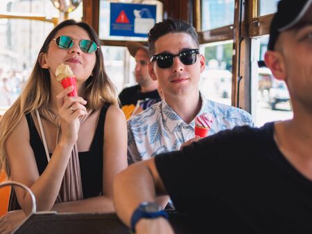 Lisbon, Portugal - SEPTEMBER 24 2017: Tourists with vintage carriage tram on famous 28 line in Lisbon.のeditorial素材