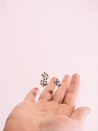 Classic play board game dices in hand. Toning.