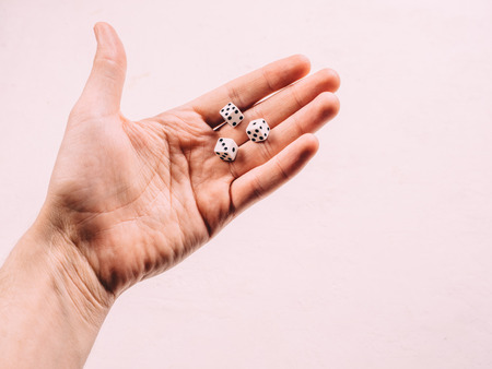 Classic play board game dices in hand. Toning.