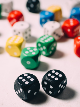 Color dices in hand. Board game casino risk luck.