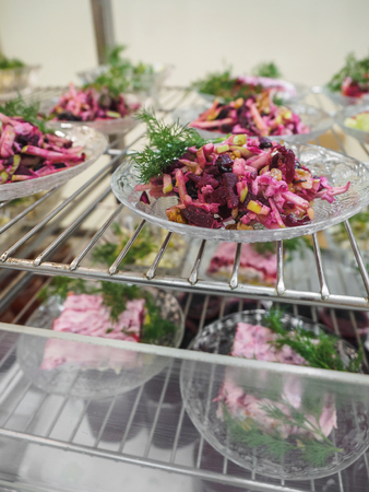 Cuisine cafeteria buffet with food. Self-service food display showcase.の写真素材