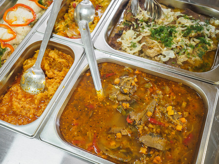 Cuisine cafeteria buffet with food. Self-service food display showcase.の写真素材