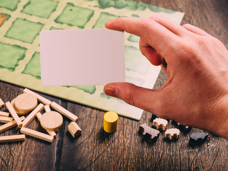 Farm agricola board game with fields figures and animals.のeditorial素材