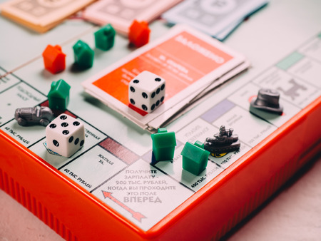 Classic business monopoly board game with dices and field.のeditorial素材