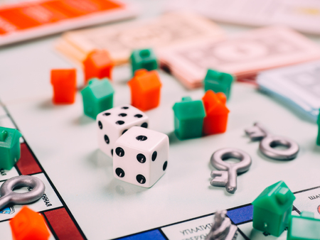 Classic business monopoly board game with dices and field.のeditorial素材