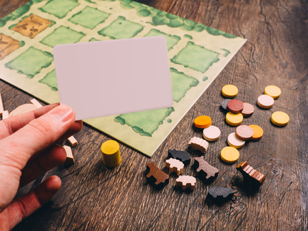 Farm agricola board game with fields figures and animals.のeditorial素材