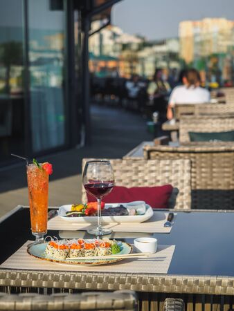 Sky cafe on the roof terrace with view of modern city.の写真素材