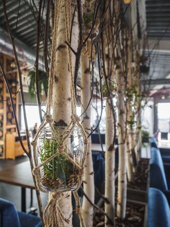 Restaurant interior with tables, chairs and lights.の写真素材
