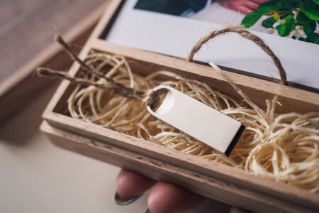 Wooden retro brown box with usb flash card.の写真素材