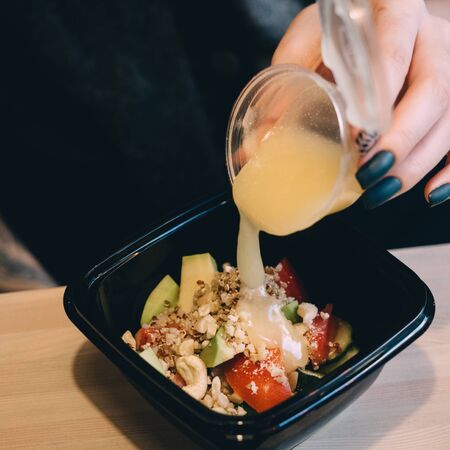 Quinoa Salad with pepper, avocado, nuts and mango sauce.の写真素材
