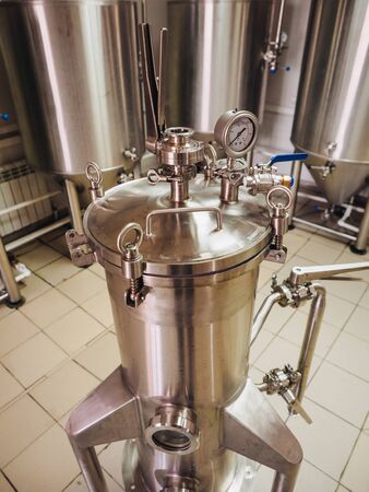 Brewery alcohol factory production. Modern containers technology.の写真素材