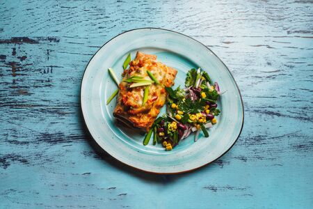 Chimichanga - spicy mexican dish with pork and vegetables.の写真素材