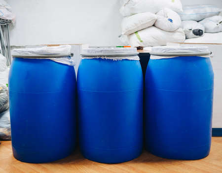 Warehouse of bags with clothes shoes textile fabrics.
