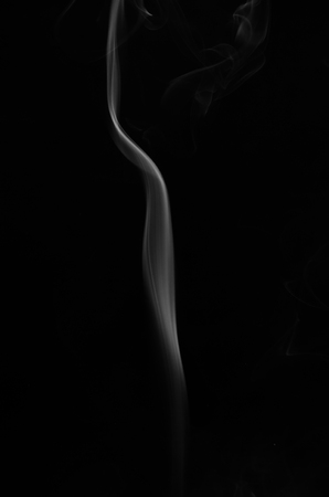 Abstract smoke isolated on dark background, with copy space.の写真素材