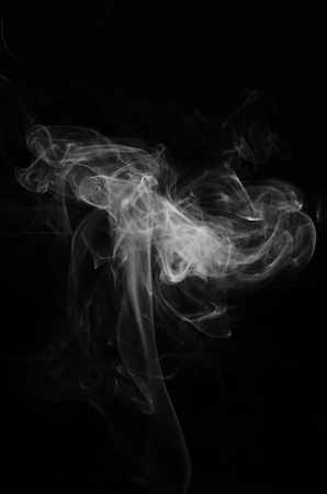 Abstract smoke isolated on dark background, with copy space.の写真素材