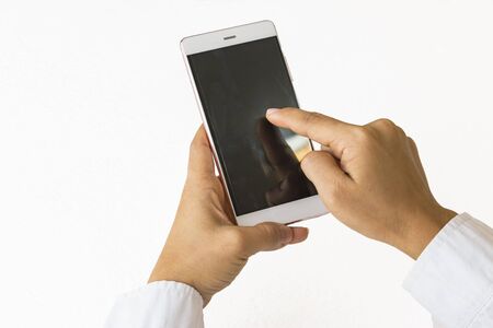 Isolated female hand holding a phoneの写真素材