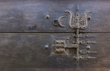 Old rusted hinge holding floating wooden dock togetherの写真素材