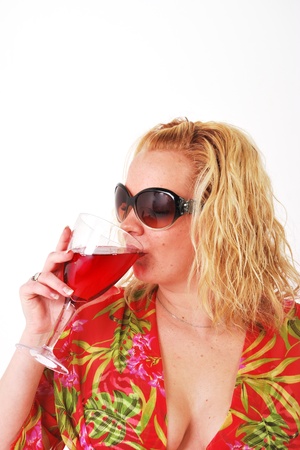 Pretty girl enjoying a glass of wineの写真素材