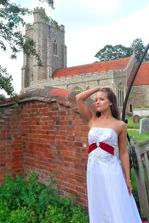bride in white dress outside churchの写真素材