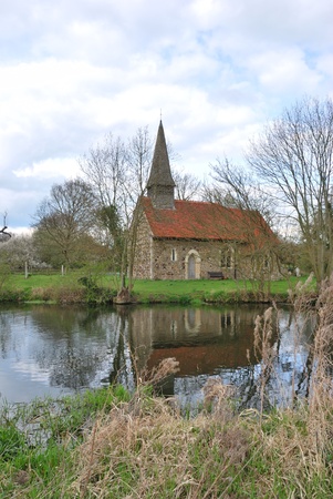 small church by riverの写真素材