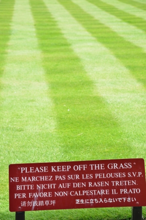 Multilingual keep off the grass signの写真素材
