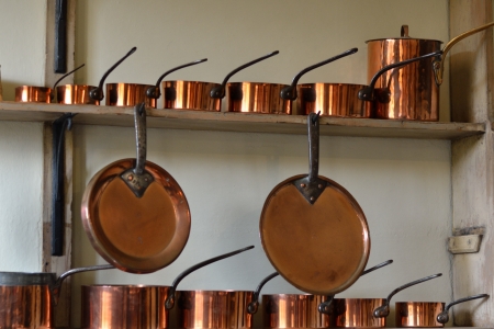 rows of copper potsの写真素材