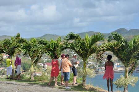 DENNERY  ST LUCIA CARIBBEAN 19  January  2015: Tourists looking over small Caribbean Townのeditorial素材