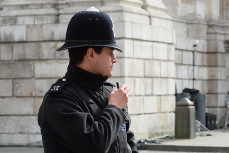 CITY OF LONDON ENGLAND 13 March 2015:  English Policeman with radioのeditorial素材