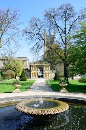 Formal traditional  English garden with fountain  in foreground