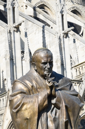 Statue of John Paul II outside Notre dameの写真素材