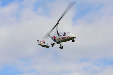 DUXFORD CAMBRIDGESHIRE UK 20 August 2015: Small gyrocopter in flight
