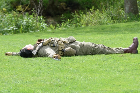 CRESSING TEMPLE ESSEX UK  17 May 2015: Soldier Playing Dead in Re-enactmentのeditorial素材