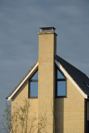 Modern English End of House with Chimneyの写真素材