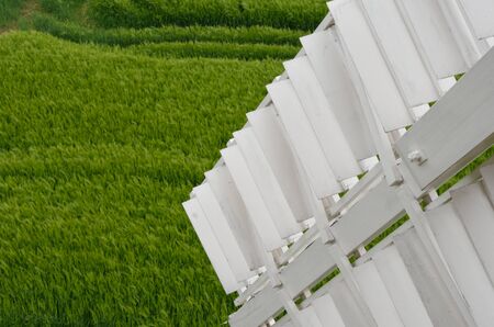 Detail of sail of window with field in backgroundの写真素材