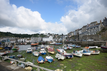 Mevagissey Cornwall , United Kingdom - July 02, 2016: Harbour of small Cornish fishing village with...