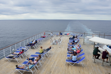 North Sea  England, United Kingdom -  July  28, 2016: Passengers relaxing on deck of cruise ship out in open seaのeditorial素材