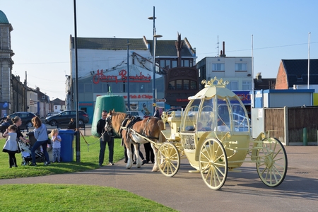Great Yarmouth  Norfolk  , United Kingdom - October 25, 2016:  Cinderella carriage ride by Great Yarmouth seafrontのeditorial素材
