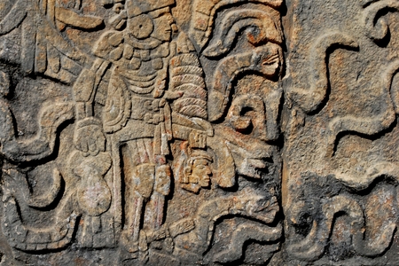 Detail of Mayan wall carving with warriorの写真素材