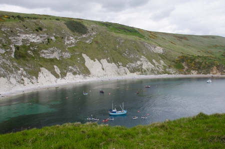 Lulworth Cove Dorset United Kingdom -22 April 2017: Fishing boat in Lulworth Cove Dorsetのeditorial素材