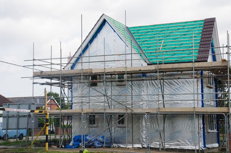 Elmstead Essex United Kingdom  -17 July  2017: Scaffolding on side of new large houseのeditorial素材