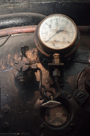 Norfolk  United Kingdom   August  21 2017: Grungy details of gauge in steam trainのeditorial素材