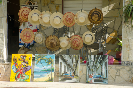 Jibacoa Cuba - 29 January 2018: souvenir shop front with hats and paintingsのeditorial素材